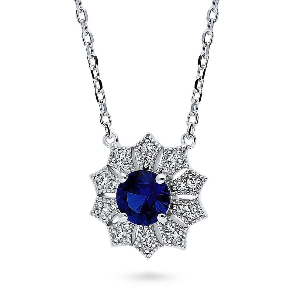 Front view of Halo Flower Blue Round CZ Pendant Necklace in Sterling Silver, 4 of 6
