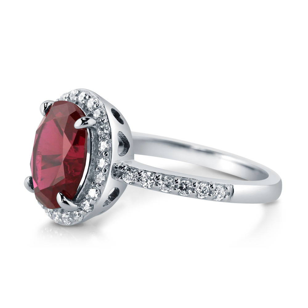 Angle view of Halo Simulated Ruby Oval CZ Ring in Sterling Silver, 5 of 11