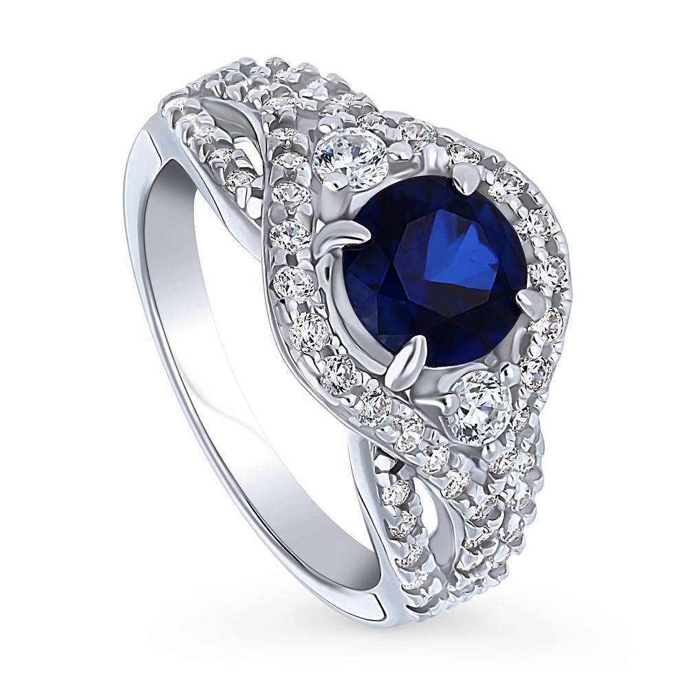 Front view of 3-Stone Woven Halo Sapphire-Blue CZ Ring in Sterling Silver, 4 of 10