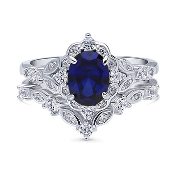 Chevron Halo Simulated Blue Sapphire CZ Ring Set in Sterling Silver