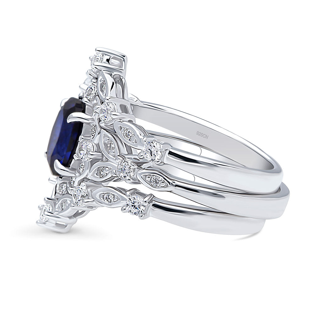 Angle view of Halo Simulated Blue Sapphire Oval CZ Ring Set in Sterling Silver, 5 of 18